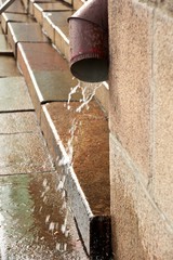 Downspout during the rain in city