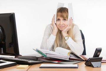 Business woman buried in paper documents