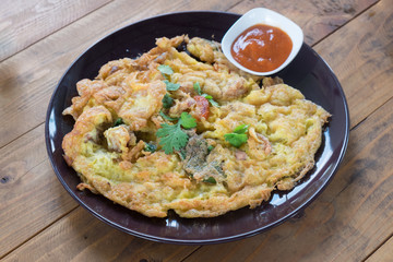 Omelet with vegetables on dish