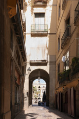  Barcelona. Spain. Gothic Quarter - narrow street.