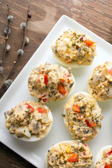 stuffed eggs with peppers, mushrooms and herbs - selective focus