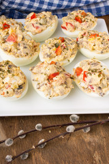 stuffed eggs with peppers, mushrooms and herbs - selective focus