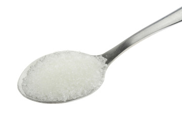 Spoonful of white sugar isolated on white