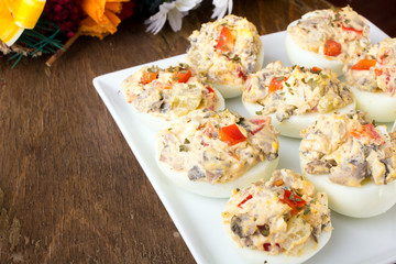 stuffed eggs with peppers, mushrooms and herbs - selective focus
