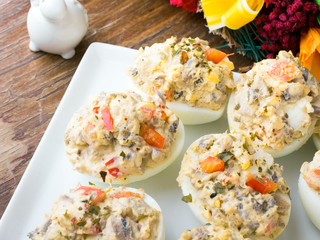 stuffed eggs with peppers, mushrooms and herbs - selective focus