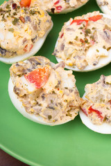stuffed eggs with peppers, mushrooms and herbs - selective focus