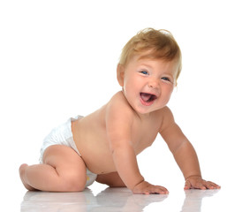 Infant child baby girl in diaper crawling happy laughing smiling