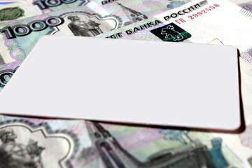 Clean card lying on the banknotes of the Bank of Russia
