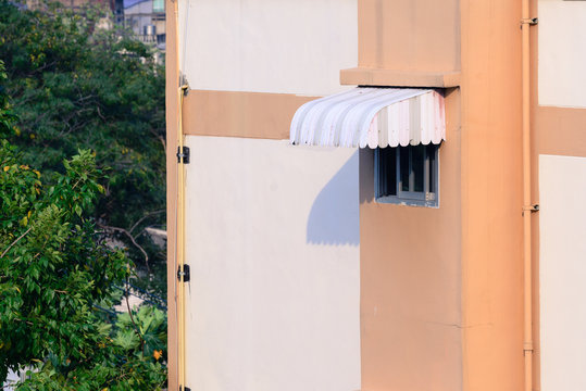 Rainproof awning of slide window on sunny day.