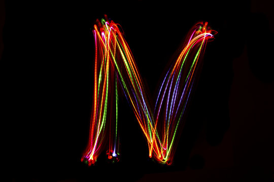 Word writing from light on the black background.