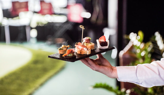 Fototapeta waiter with spanish appetizer