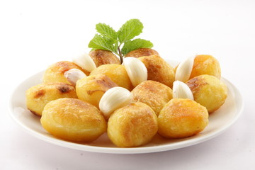 Delicious baked potatoes with garlic,Selective focus .