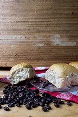 Coffee and bread wooden background