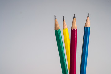 green pencil yellow pencil red pencil and blue pencil closeup