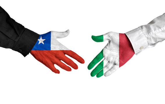 Chile and Italy leaders shaking hands on a deal agreement