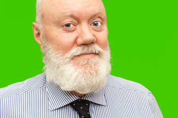 Elderly man is posing on green background, color and contrast manipulated