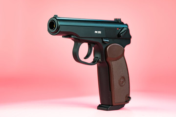 Gun on pink background
