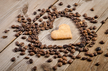 Frame- heart from coffee beans and cookies-heart  inside it on