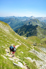 Fototapeta na wymiar Tourists climbing in Alps