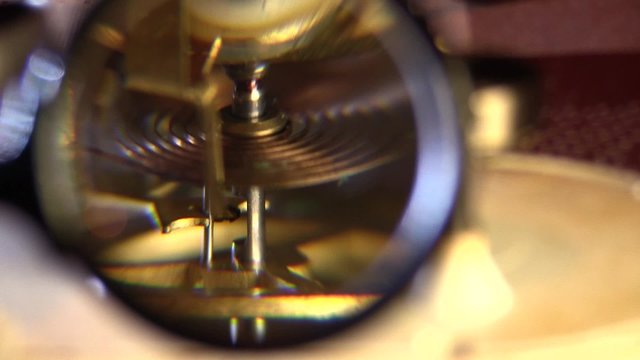 old dusty clock mechanism with magnifier 