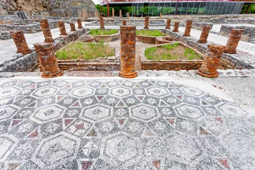 Deurstickers View of the inner pond and garden with the Peristyle columns and mosaic floor, on the Swastika Domus. Conimbriga in Portugal, is one of the best preserved Roman cities on the west of the empire. © StockPhotosArt