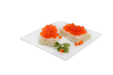 Two sandwiches with caviar on the white plate isolated on white