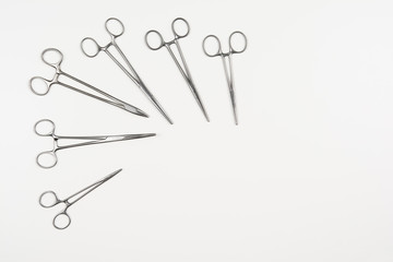 Top view of modern, sterile doctors office desk. Medical accessories on a white background with copy space around products. Photo taken from above.