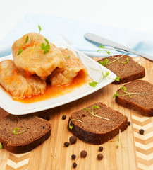 Cabbage rolls on a white plate