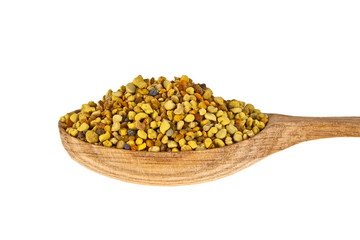 Pile of bee pollen in wooden spoon on a white background