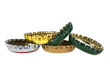 Colored beer bottle caps isolated on white background