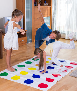 Children Playing Twister At Home.