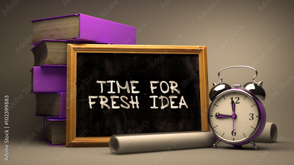 Poster time for fresh idea handwritten by white chalk on a blackboard. composition with small chalkboard an