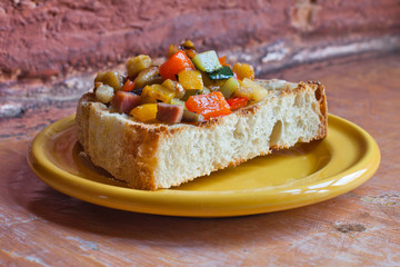 Ratatouille with bacon on the toast. Vegetable snack.