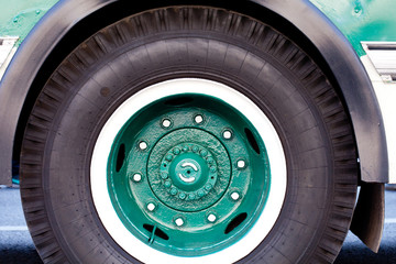 Bus wheel closeup.  (green rims)