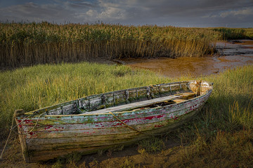Old and decaying wooden rowing boat © Alan