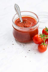 tomato sauce in a glass jar, vertical