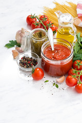 tomato sauce, pesto and ingredients for pasta, vertical