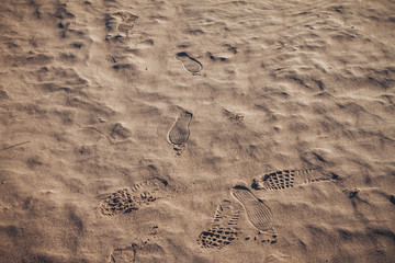 Footprint in rippled beach sand