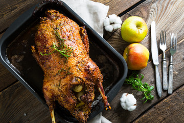 Roasted goose with apples in a rustic style