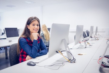 Smiling student working on computer 