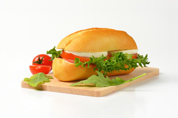bun sandwich with cheese and vegetables