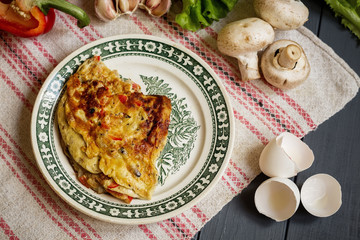 Rustic omelette with mushrooms and pepper