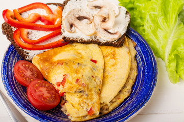Omelet in a blue plate