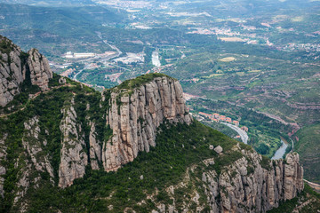 Aerial view on rocks and Monistrol de Montserrat near Santa Maria de Montserrat Abbey in Montserrat...
