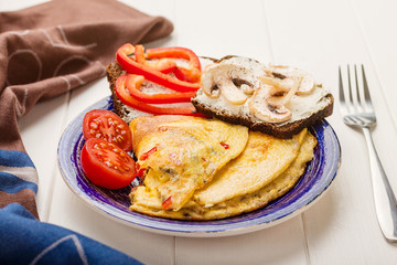 Omelet in a blue plate