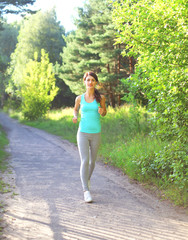 Fitness woman running in park, female runner workout, sport and