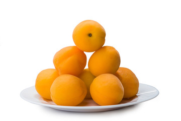 yellow peach slices on plate isolated on white