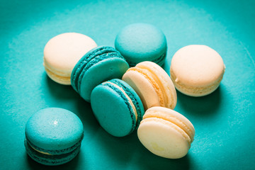 Fresh macaroons on wooden table ,vintage filter