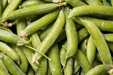 green peas on wooden table ,healthy concept