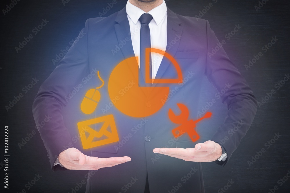 Poster Composite image of a businessman holding something